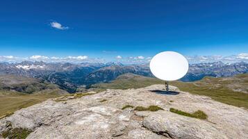 satellite dish on mountain peak with panoramic views of landscape photo