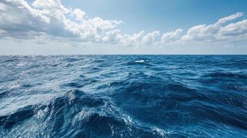Vast ocean waves under bright sky with fluffy clouds, serene and tranquil photo