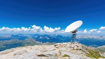 satellite dish on mountain peak offers stunning panoramic view of landscape photo