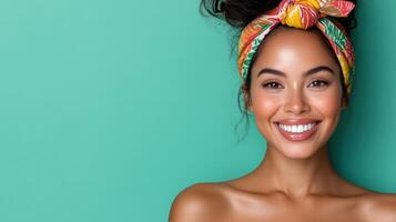 Beautiful woman with colorful headband smiling on green background photo