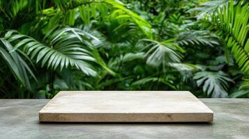 natural stone surface on table with lush green foliage in background photo