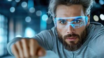 A man with glasses and beard pointing at something photo