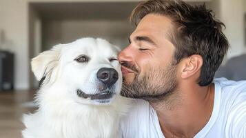 A man kissing his dog on the nose photo