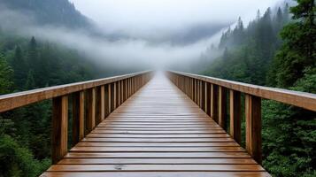 wooden bridge vanishing into thick mist, surrounded by lush trees photo