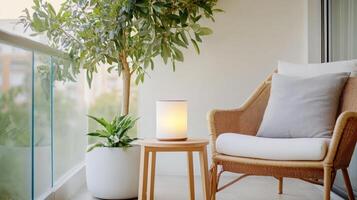 cozy reading corner featuring hammock chair, side table, and plants photo