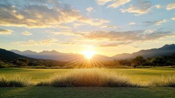 beautiful sunrise over golf course with mountains in background photo