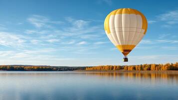 vibrant hot air balloon floats gracefully over tranquil lake, surrounded by autumn trees photo