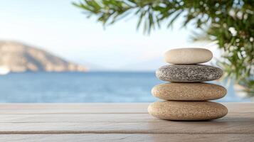 Serene spa scene with stacked stones by ocean, promoting relaxation photo