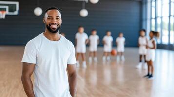 basketball coach smiles while guiding young players during practice photo