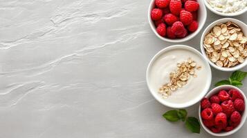 Creamy yogurt with raspberries and oats in bowls on textured surface photo