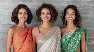 Elegant sarees in vibrant colors worn by smiling women, showcasing modern fashion photo