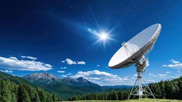Satellite dish in the mountains with a star in the sky photo
