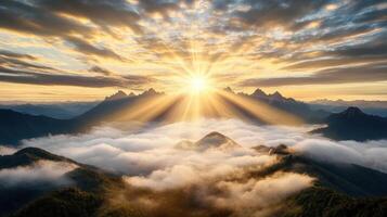 breathtaking sunrise over misty mountains, illuminating clouds below photo