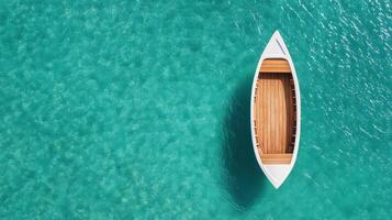 An aerial view of a boat floating in the ocean photo