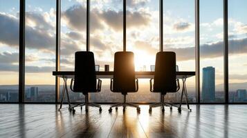 Three chairs in front of a large window with cityscape in the background photo
