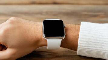 A person wearing a white sweater and an apple watch photo