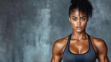 A woman with a muscular body and a black bra top photo