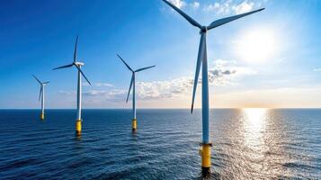 Wind turbines on coastal plain with beautiful sunset over ocean photo