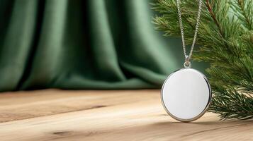 A silver round pendant on a green background photo
