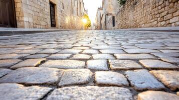 charming cobblestone street at sunrise, showcasing warm light and texture photo