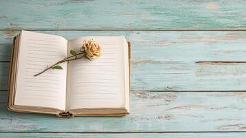 open diary with dried rose on its pages evokes nostalgia and reflection photo