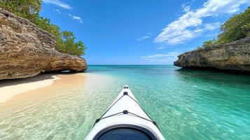 serene kayak view approaching secluded beach with clear turquoise water photo