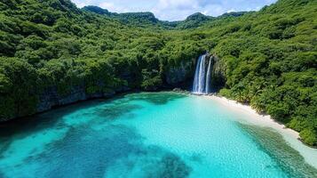 remote jungle covered island with stunning waterfall and clear blue water photo