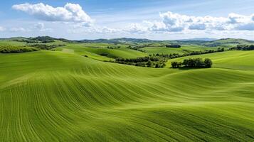 Aerial view of serene countryside with rolling green hills and lush vegetation photo
