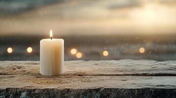 serene candle glowing softly on wooden surface, surrounded by tranquil atmosphere photo