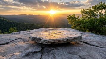 serene sunset over mountain range, casting warm light on rocky terrain photo