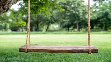 rustic wooden swing hangs from tree in serene backyard setting photo