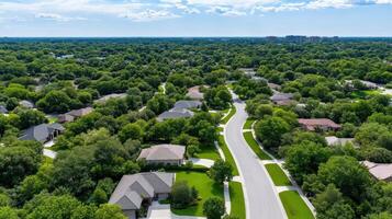 Aerial view of lush suburban neighborhood with winding roads and greenery photo