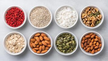 Healthy snacks, nuts, seeds, oats, goji berries, coconut, walnuts, almonds photo