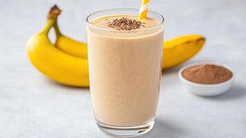 Creamy banana smoothie with protein powder and flaxseeds, perfect for refreshing boost photo