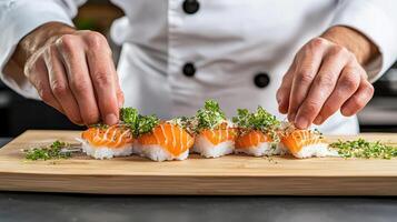 Sushi chef carefully plating sashimi dish with fresh salmon and herbs, showcasing culinary skill photo