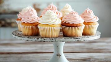 Delicious cupcakes with soft frosting on vintage stand create charming dessert display photo