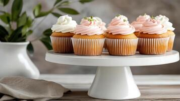 Delicious vanilla cupcakes with soft frosting, beautifully arranged on stand photo