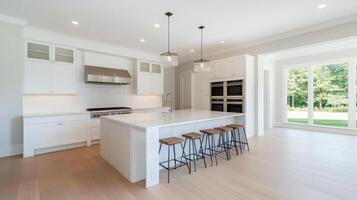 modern kitchen featuring spacious marble island, sleek cabinetry, and high end appliances photo