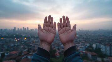 Hands raised against city skyline at sunset, symbolizing hope and connection photo