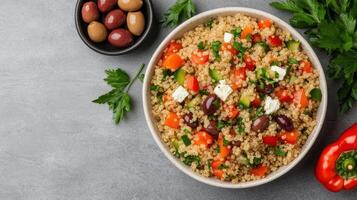 vibrant quinoa salad featuring colorful vegetables and olives, perfect for healthy meal photo