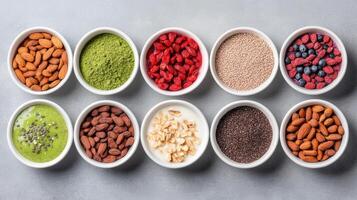 Healthy ingredients arranged in bowls, showcasing variety of nuts, seeds, and powders photo