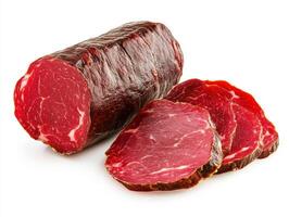 Cured meat rolls and slices on a white background photo