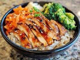 Delicious chicken teriyaki bowl with vegetables and rice photo