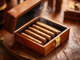Collection of handmade cigars in a wooden box on a table photo