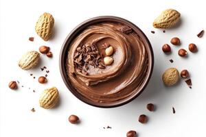 Creamy chocolate spread with nuts and chocolate shavings photo