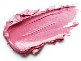 Bright pink paint texture spread on white surface photo