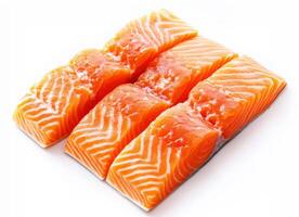 Fresh salmon fillets arranged neatly on a white surface photo