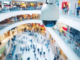 Surveillance camera monitors busy shopping mall environment photo