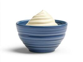 Creamy dessert served in a blue bowl with swirled texture photo