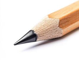 Close-up of a sharpened pencil on a plain background photo